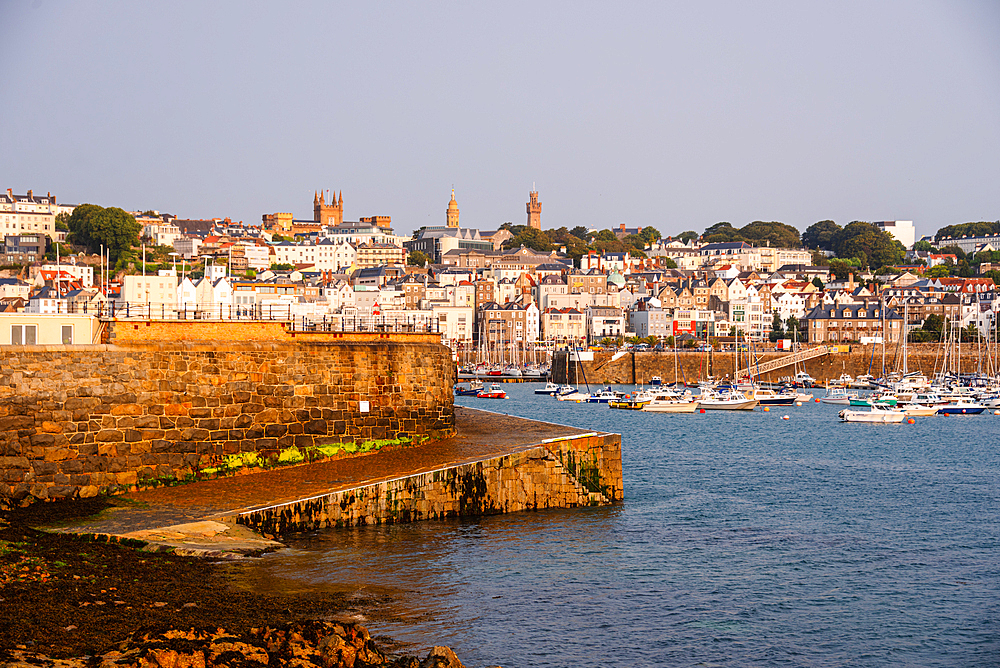 Golden Hour View of Saint Peter Port Waterfront with Historic Architecture Guernsey Channel Islands