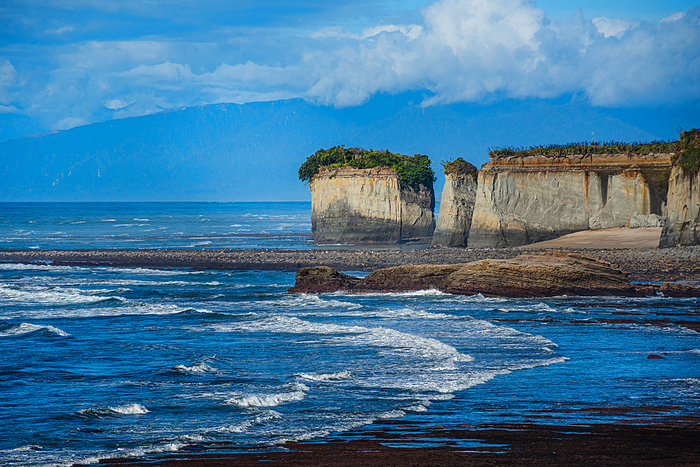 White Cliffs on the rugged Tasman Sea coast of West Coast near Cape Foulwind. New Zealand, with dramatic limestone formations and waves below
