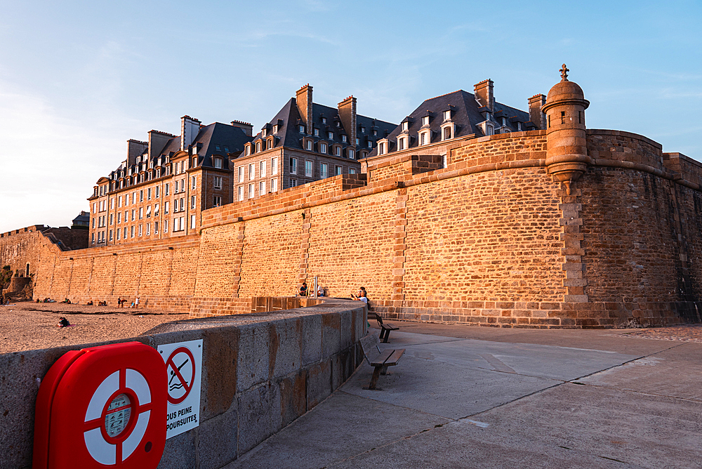 Historic stone ramparts and old town walls Saint Malo Brittany France evening light on fortified seafront