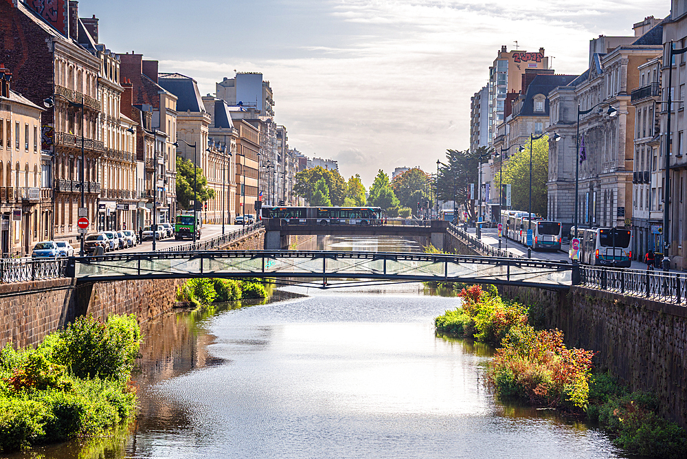 River Vilaine flowing through Rennes city center with historic bridges and traditional French architecture in Brittany France