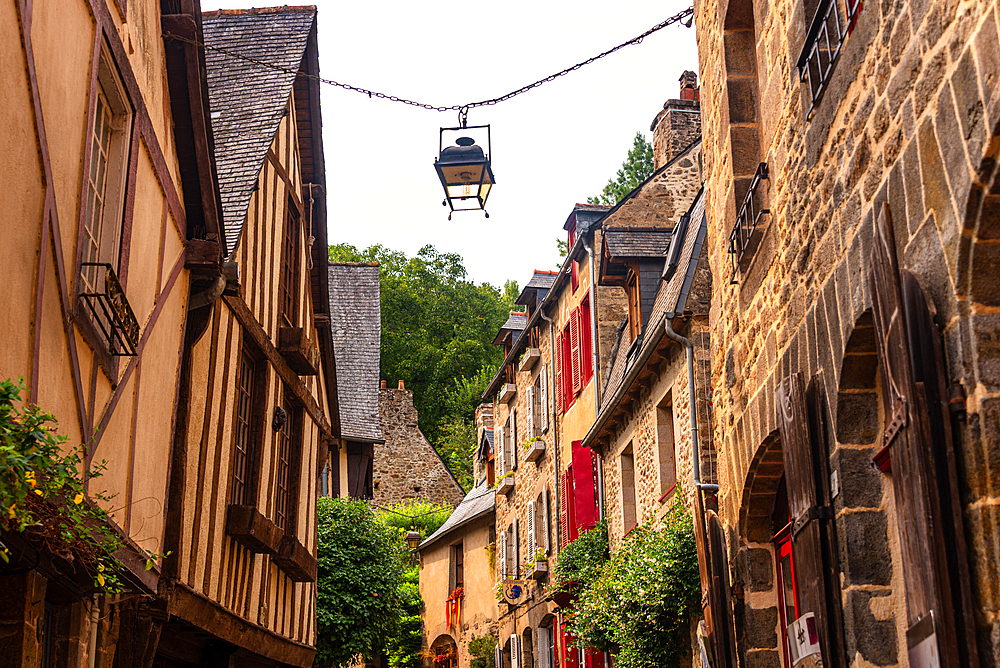 Medieval street with lanterns and half-timbered houses in Dinan Brittany France historic old town