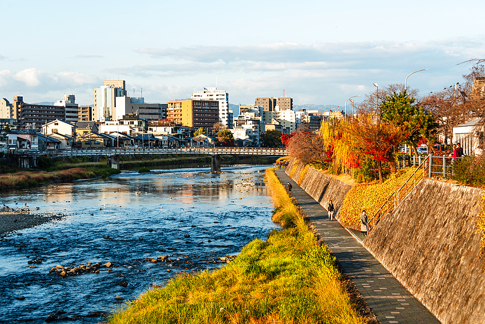 Sunset in Kyoto above the Kamo River walk and city skyline, Kyoto, Honshu, Japan, Asia