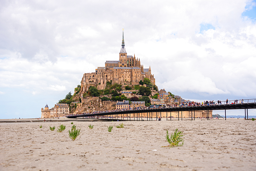 Iconic view of Mont Saint-Michel rising above the tidal sands, Normandy, France.