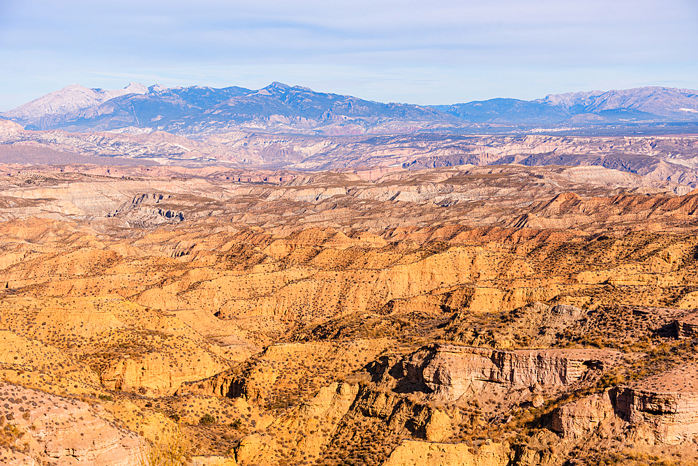 Arid badlands terrain in the Desierto de Gorafe, Granada, Spain