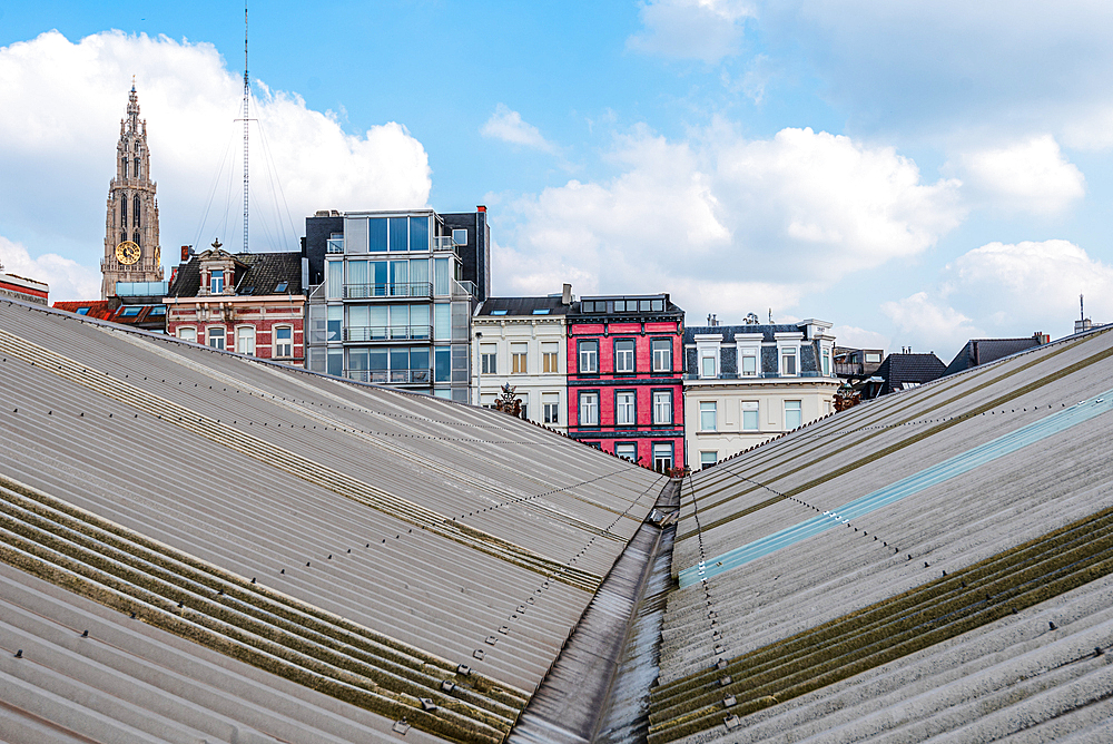 View over the modern roof structure of the MAS Museum (Museum aan de Stroom) with the Cathedral of Our Lady in the background, Antwerp, Belgium