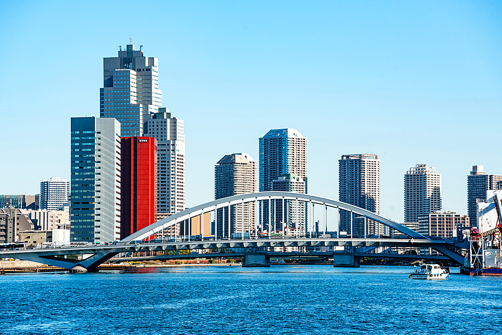 Arched bridges over the Sumida river and blue sky day with skyscrapers of Kiba in the background, Tokyo, Honshu, Japan, Asia