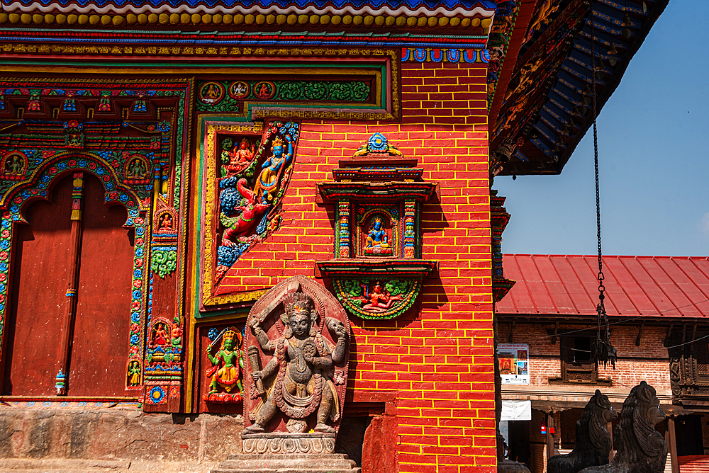 Details of the colorful Hindu stone and wood carving on walls of Nepal's oldest Hindu temple devoted to Vishnu, Changu Narayan, UNESCO World Heritage Site, Changunarayan, Kathmandu Valley, Nepal, Asia