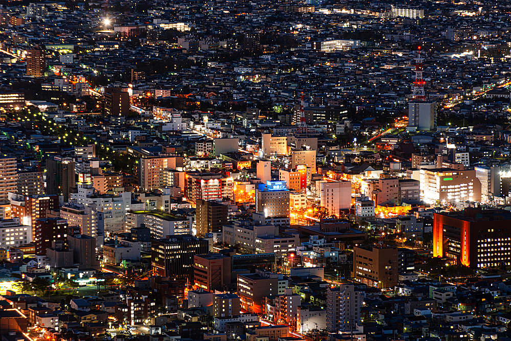 Aerial of city centre skyline at night, Hakodate, Hokkaido, Japan, Asia