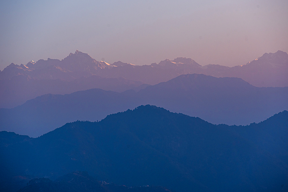 Beautiful puruple sunrise colour gradient spread across mountain chains, including Dorje Lakpa, Himalayas, Nepal, Asia