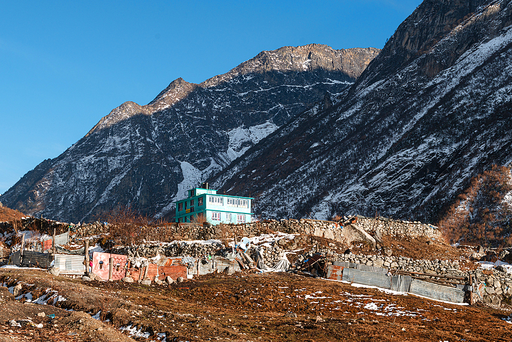 Turquoise Lodge in front of Mountain ranges, Lang Tang Village, a high altitude village on the Lang Tang Valley Trek, Himalayas, Nepal, Asia