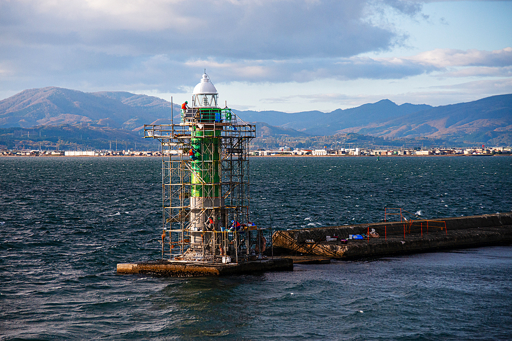 Green lighthouse being constructed in the sea of Hakodate, Hokkaido, northern Japan, Asia