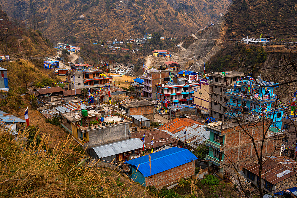 View over the roof tops of the Himalayan village of Syapru Besi on Pasang Lhamu Highway, Nepal, Asia