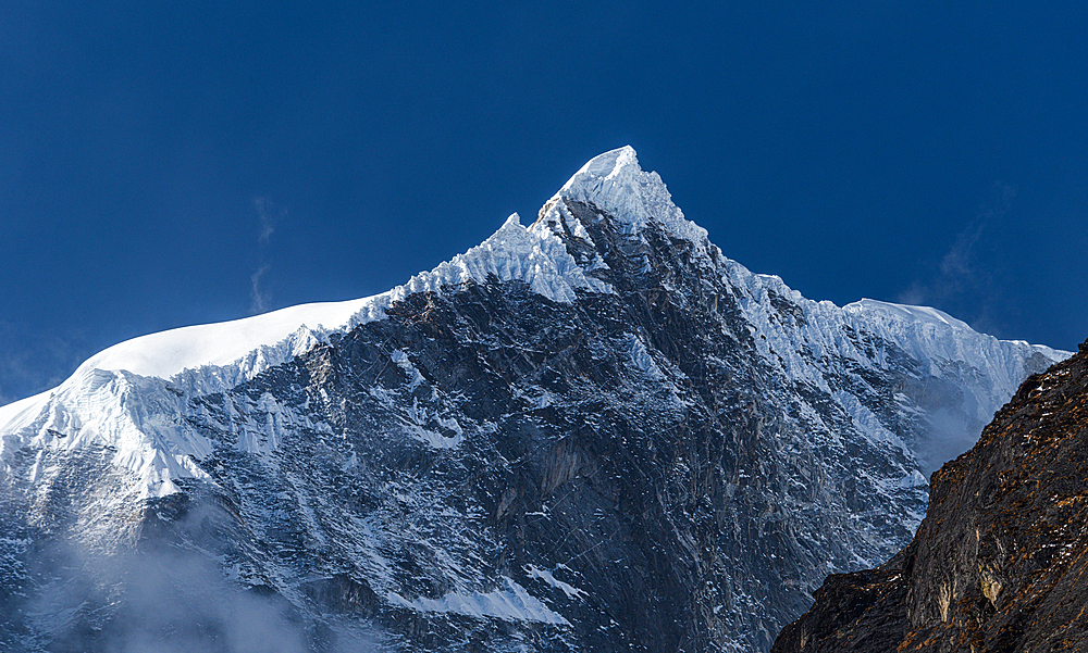 Dramatic icy summit of Langtang Lirung, high in the Himalayas of Nepal, Asia