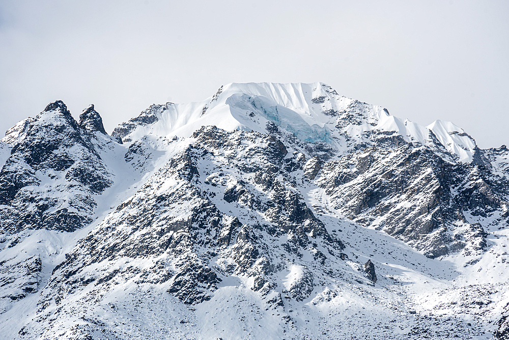 Close up of a towering snowy ice capped mountain range, Langtang Valley Trek, Himalayas, Nepal, Asia