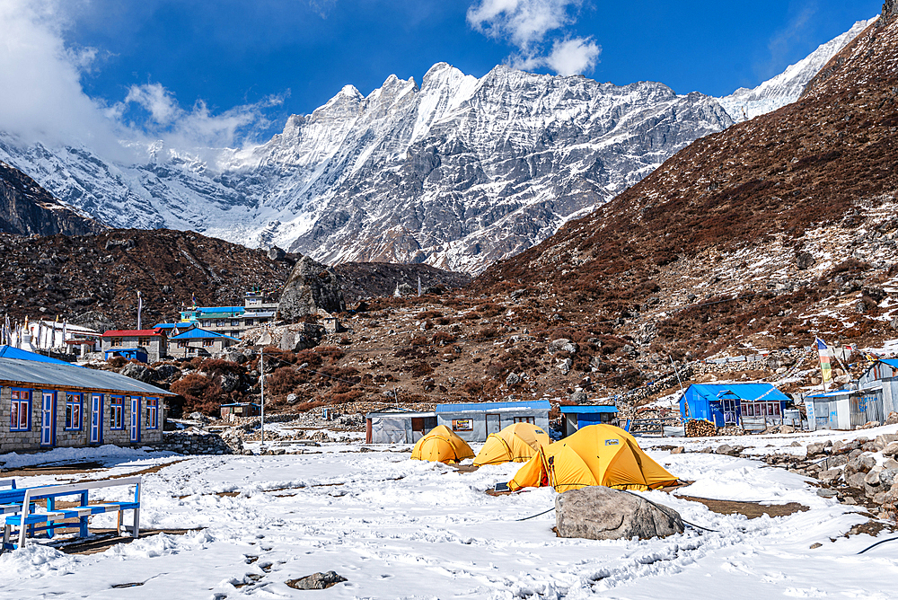 Yellow expedition tents in front of Langtan Lirung, Kyanjin Gompa, Langtang Valley trek, Himalayas, Nepal, Asia