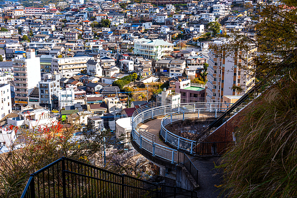 Glover Sky Road walking path in front of the skyline and rooftops of Nagasaki, Kyushu, Japan, Asia