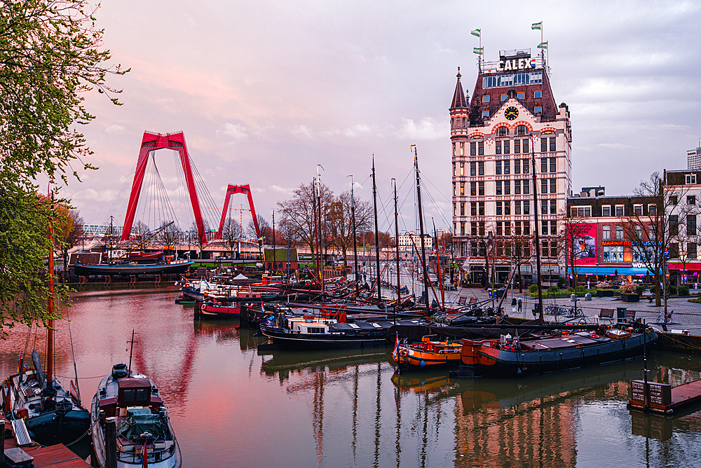 Sunset over the city skyline with The Witte Huis (White House) and old harbour, Rotterdam, South Holland, The Netherlands, Europe