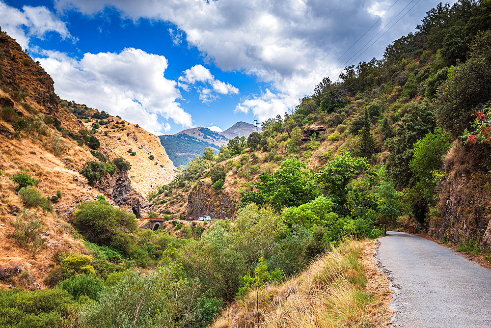 Hiking trail along rugged arid mountain valley of the Sierra Nevada, Andalusia, Spain, Europe