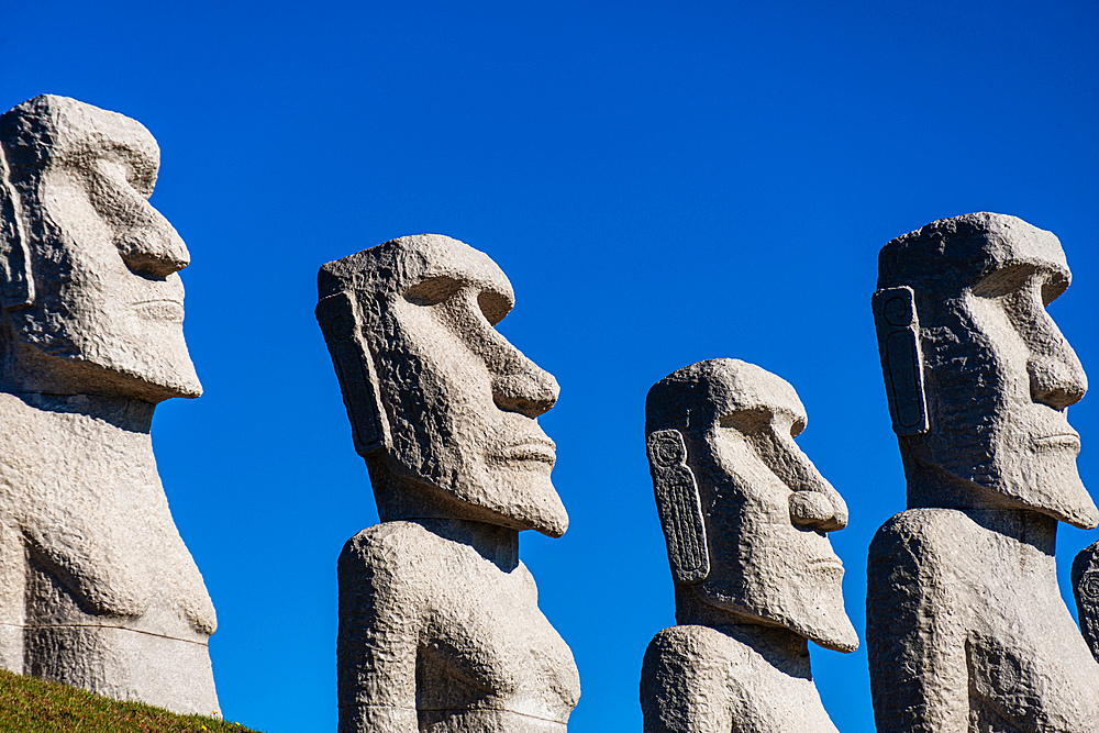 Moai statues against a blue sky, Makomanai Takino Cemetery, Hill of the Buddha, Sapporo, Hokkaido, Japan, Asia