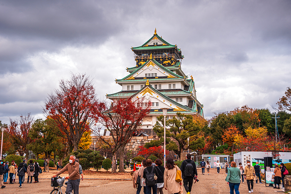 Osaka Castle in autumn with visitors in front, Osaka, Honshu, Japan, Asia