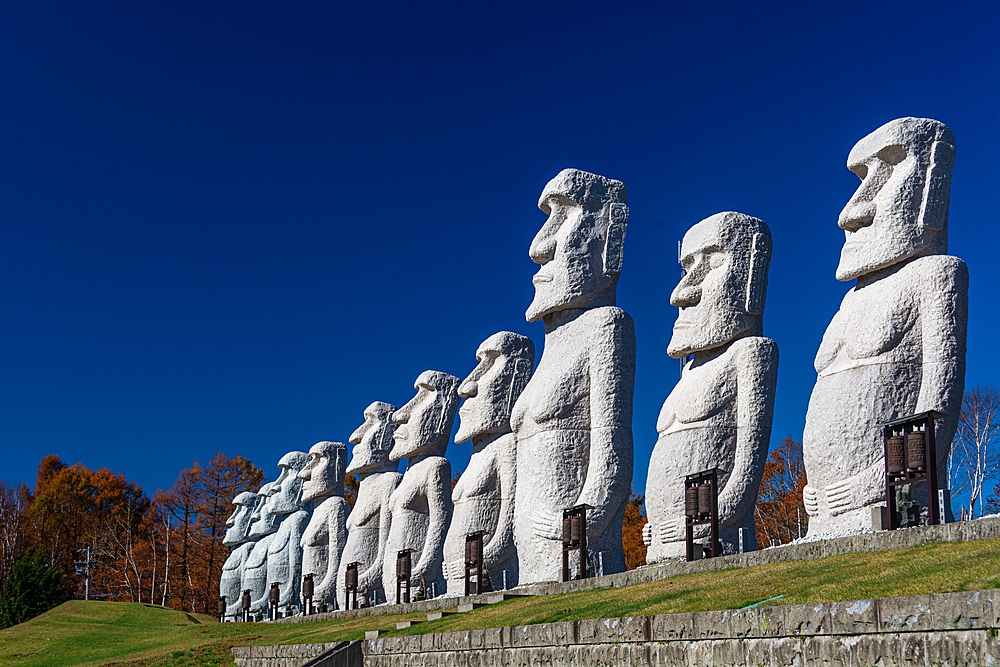 Moai statues against a blue sky, Makomanai Takino Cemetery, Hill of the Buddha, Sapporo, Hokkaido, Japan, Asia