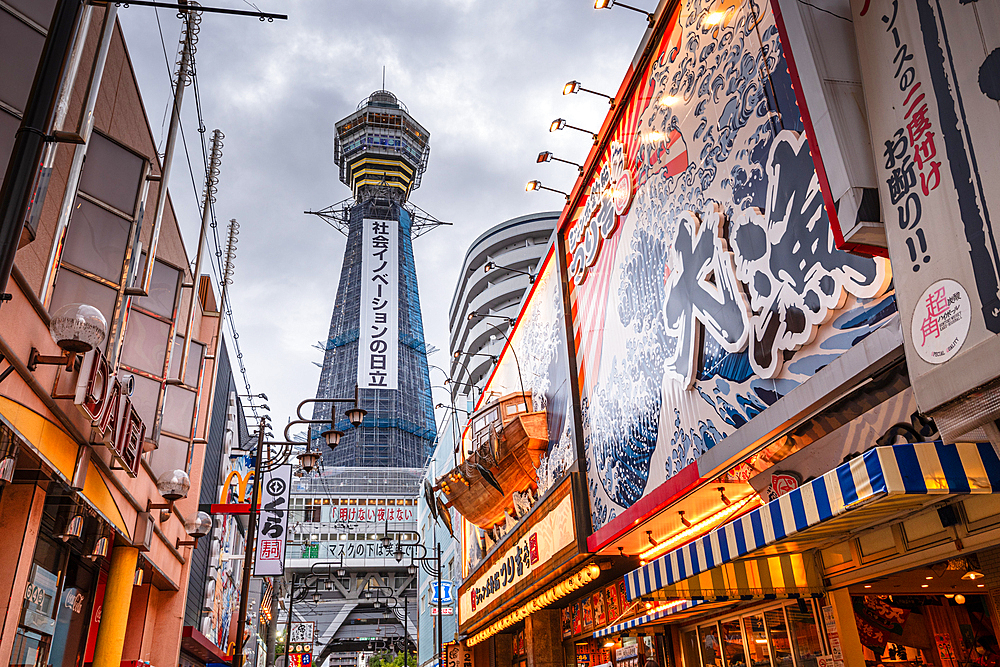 Evening lights in the Shinsekai area, and view of Tsutenkaku Tower and restaurants neon lights, Osaka, Honshu, Japan, Asia