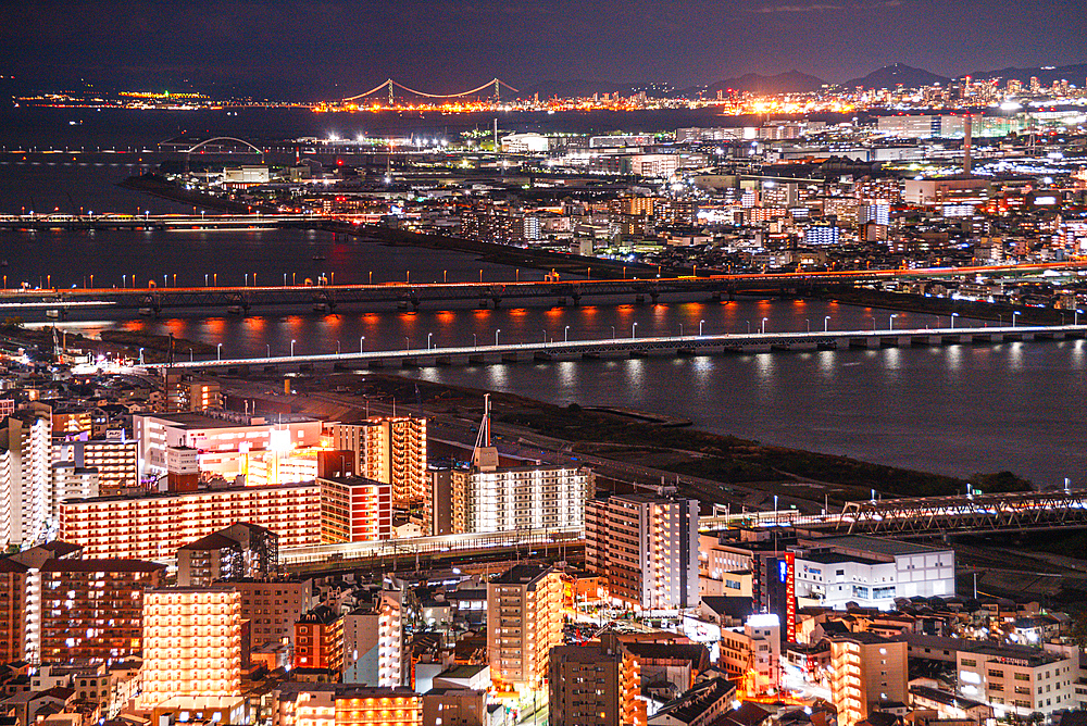 Highway and railway bridges crossing the Yodo River, night skyline, Osaka, Honshu, Japan, Asia