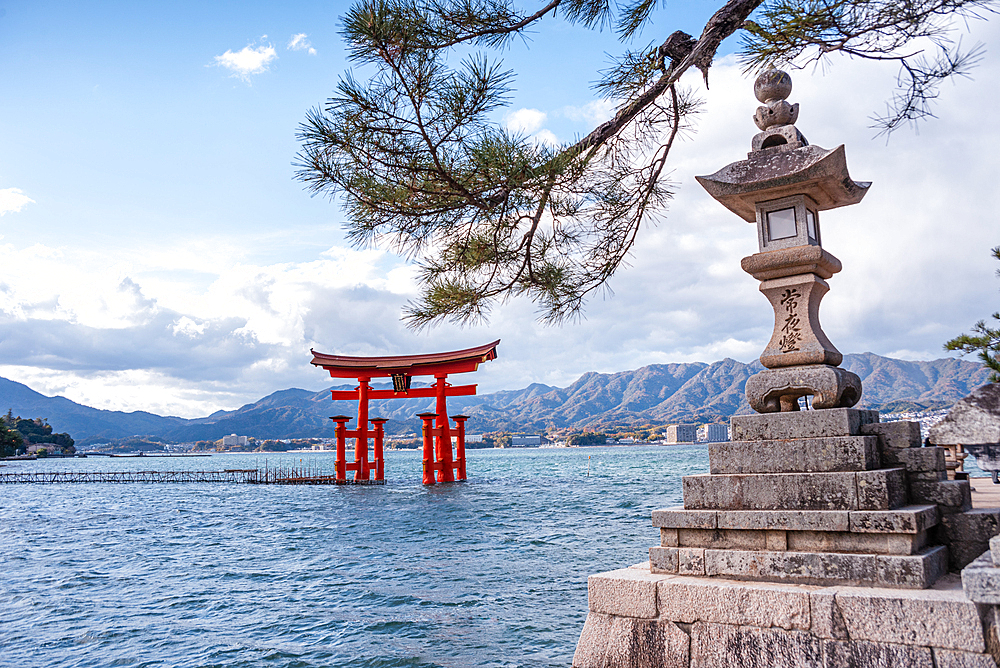 Zen stone lanterns and the landmark Otori gate, Torii Gate of Miyajima, UNESCO World Heritage Site, Hiroshima Prefecture, Honshu, Japan, Asia