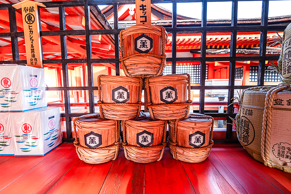 Sake barrels with traditional paintings, at Itsukushima Shrine on Miyajima Island near Hiroshima. Japan Tempel shinto. Famous shrine with floating torii Otori