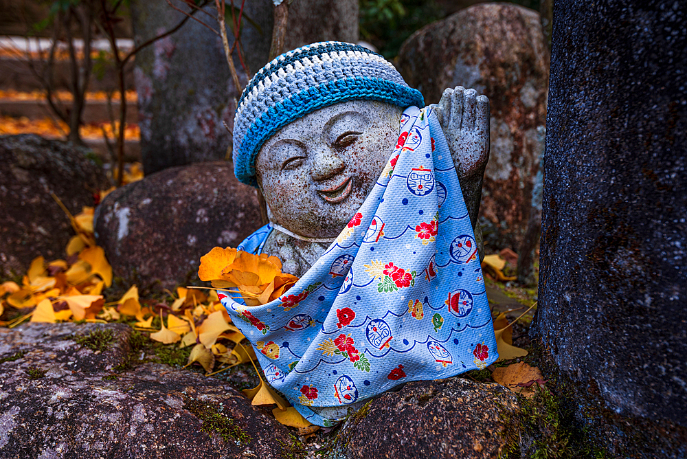 Japanese Jizo statue on Miyajima Island near Hiroshima. Japan Tempel shinto.