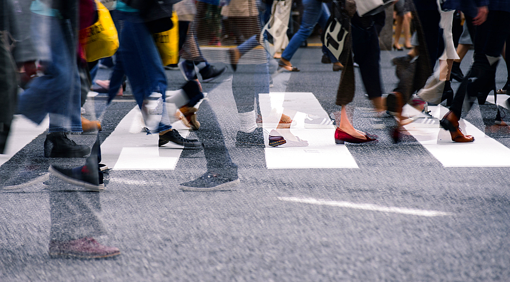 Close up view of Shibuya Crossing with people crossing street in a multi exposure, Tokyo, Honshu, Japan, Asia