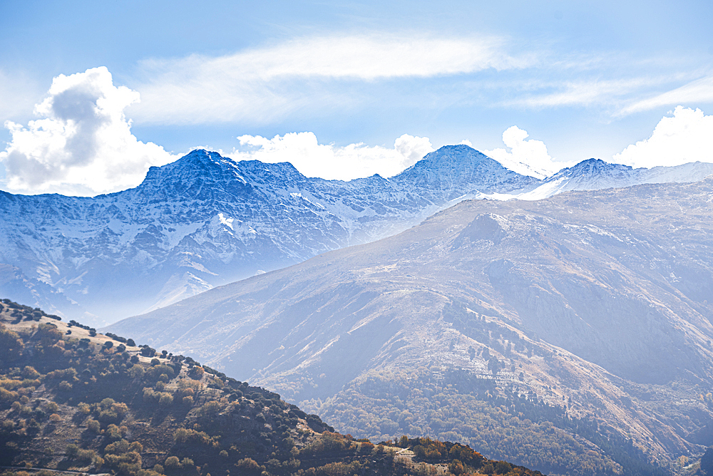 Panoramic view of the snowy sierra nevada with Alcazaba, Mulhacen View from Güejar Sierra, Sierra Nevada, Granada, Spain