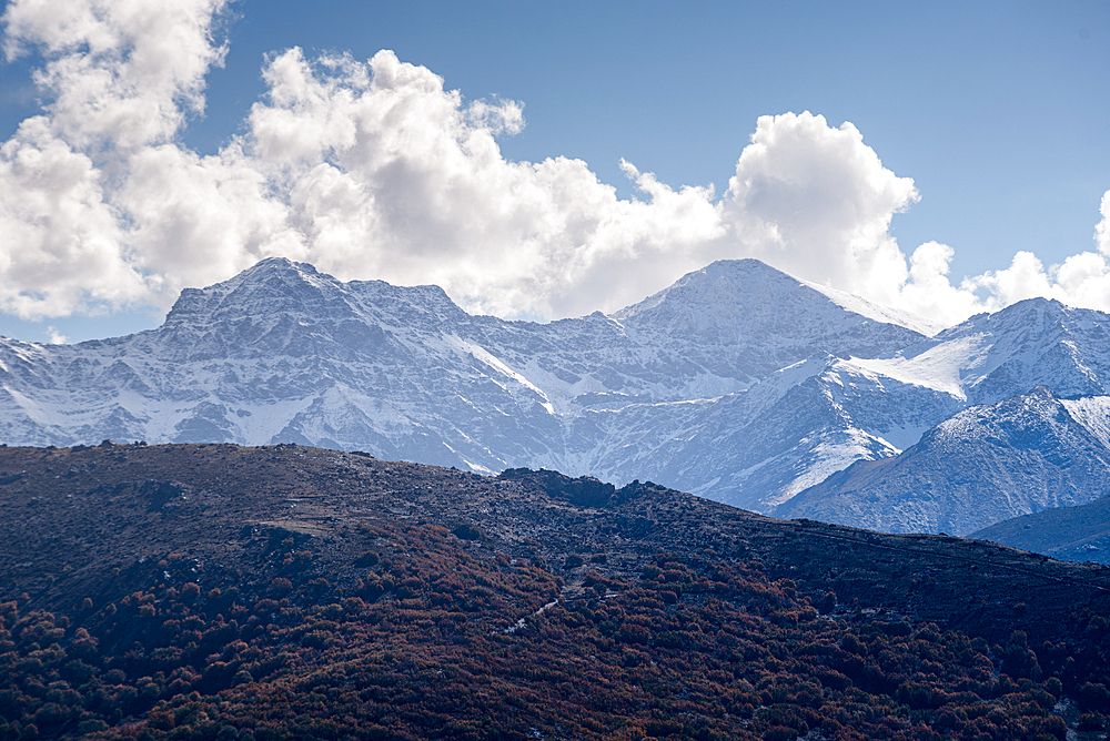 Panoramic view of the snowy sierra nevada with Alcazaba, Mulhacen and Pico de Veleta. View from Güejar Sierra, Sierra Nevada, Granada, Spain