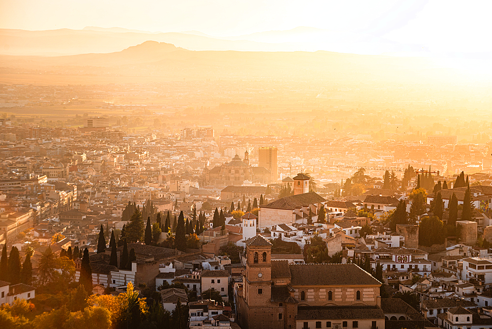 Atmospheric hazy sunset over Albaicin, UNESCO, Granada, Andalucia, Spain