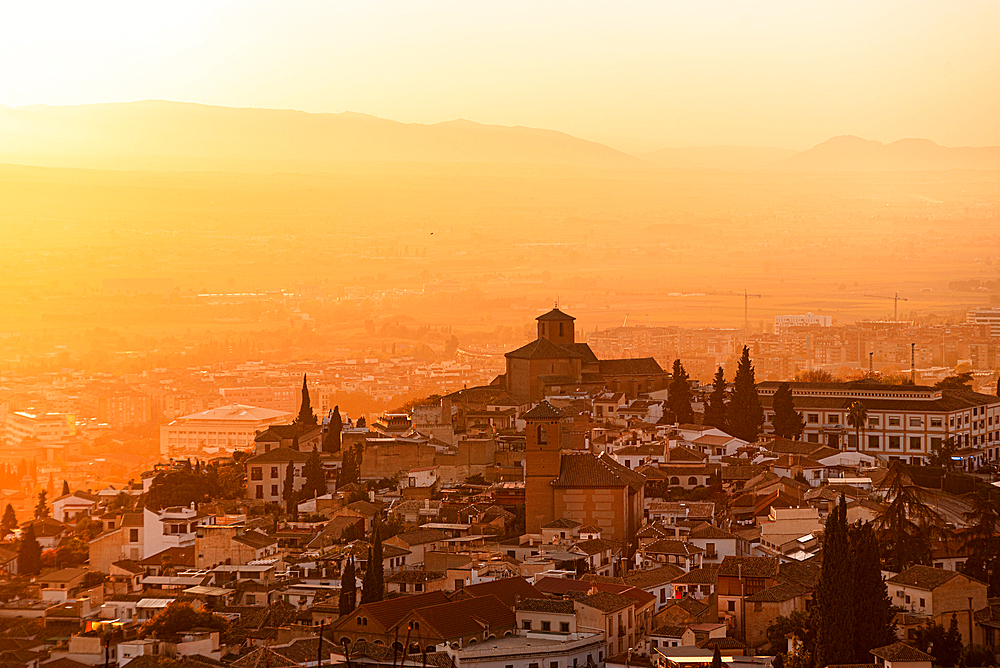 Atmospheric sunset above historic Albaicin and Iglesia de San Cristobal, UNESCO, viewed from San Miguel Alto, Albaicin, Granada, Andalucia, Spain