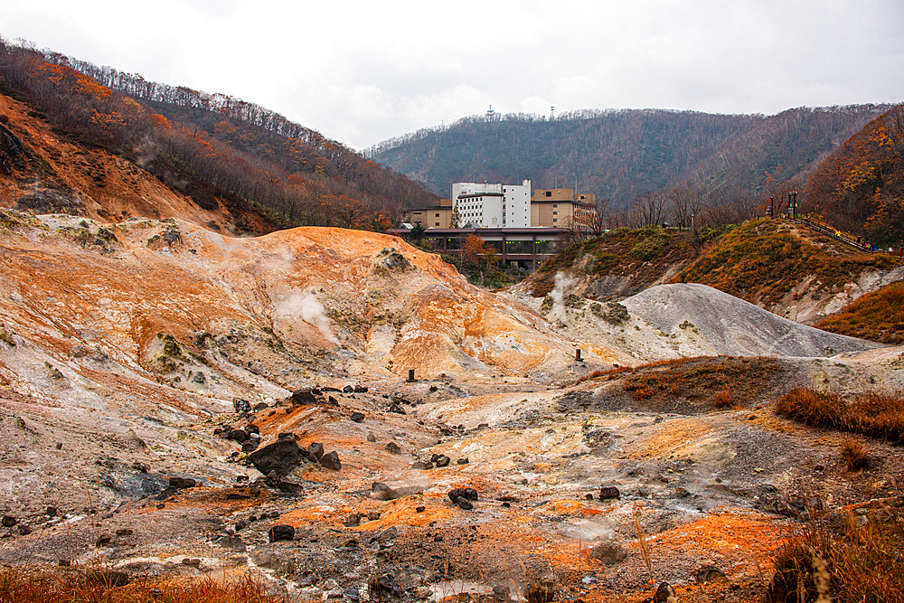 Volcanic sulphur pits in front of a hotel complex, Noboribetsu, Hokkaido, Japan, Asia