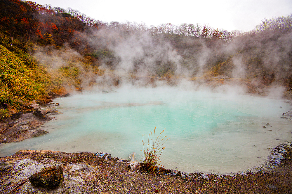 Steaming turquoise blue volcanic pond of Hell Valley, Noboribetsu, Hokkaido, Japan, Asia