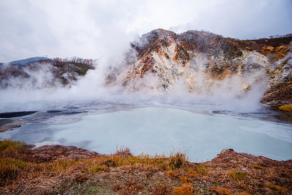 Volcanic field and steaming pond in Noboribetsu, Hell Valley, Hokkaido, Japan, Asia