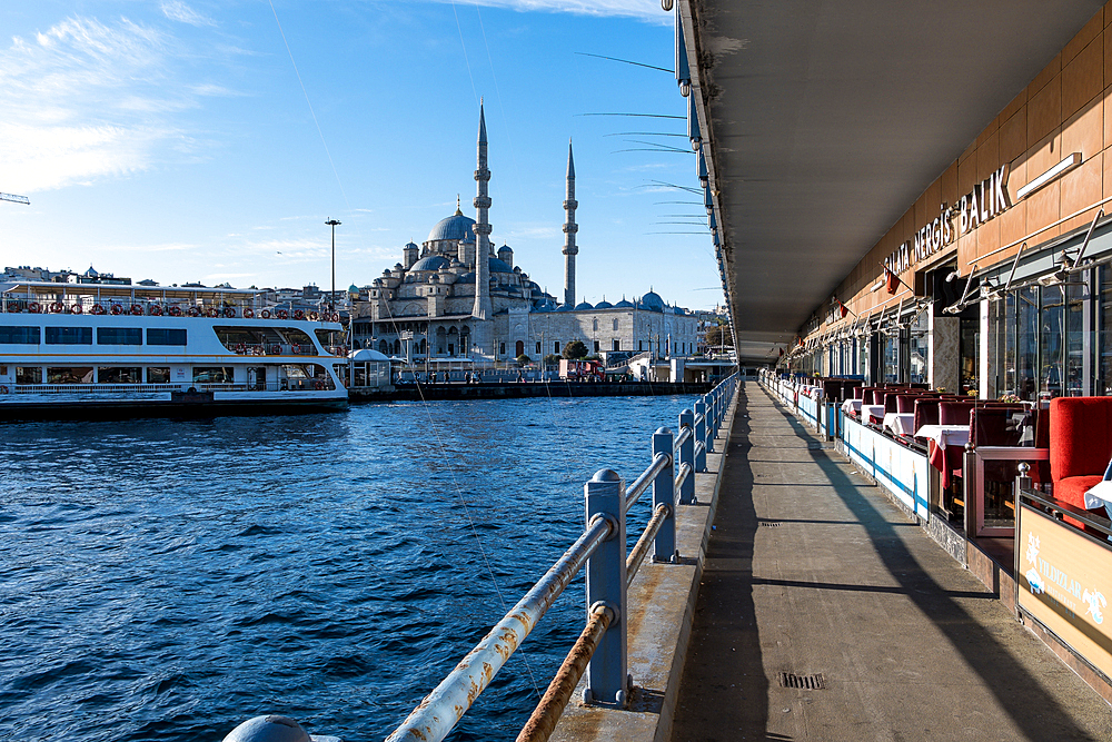 Cityscape from the Galata Bridge, spanning the Golden Horn, an arm of the sea, with the New Mosque (Yeni Cami), an Ottoman imperial mosque and landmark in the background, Istanbul, Turkey, Europe