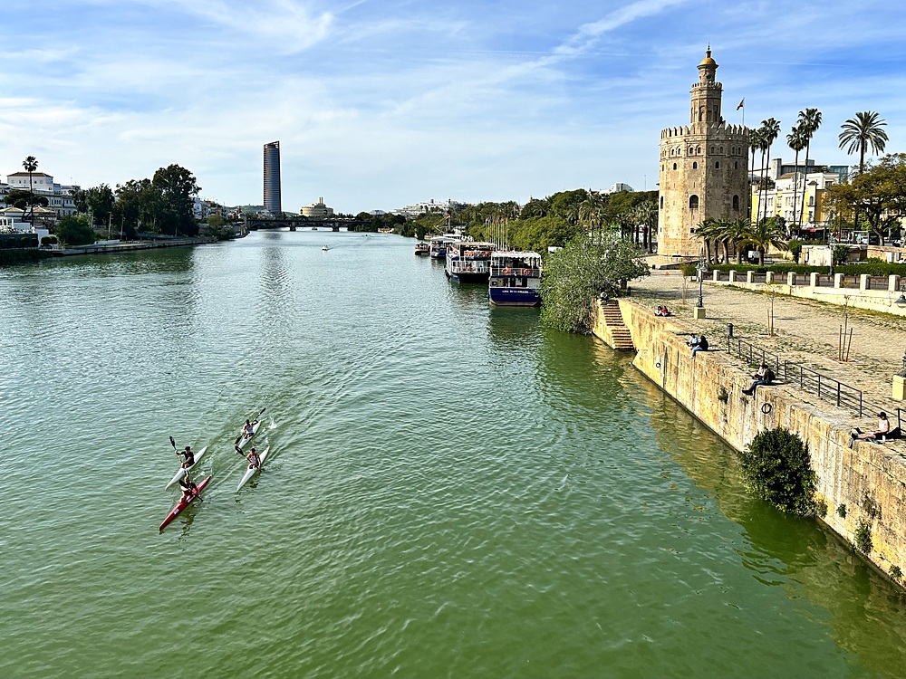 View of the Guadalquivir River in Seville, Spain with the Torre del Oro (Tower of Gold), a dodecagonal military watchtower erected by the Almohad Caliphate in order to control access to Seville via the river on the right.