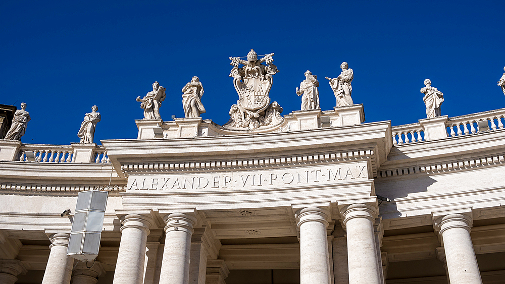 Detail of Doric colonnades in St. Peter's Square framing the entrance to St. Peter's Basilica, Vatican City, the papal enclave in Rome, UNESCO World Heritage Site, Rome, Lazio, Italy, Europe