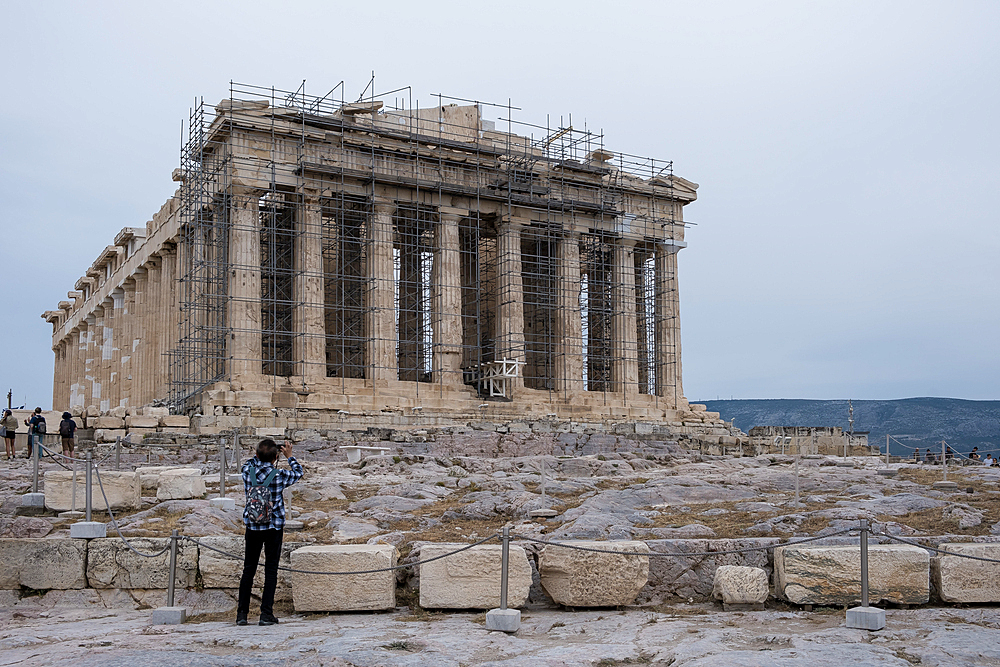 Detail of the Parthenon, a former temple dedicated to the goddess Athena, located on the Acropolis of Athens. The Acropolis is an ancient citadel situated on a rocky outcrop above the city of Athens, Greece.