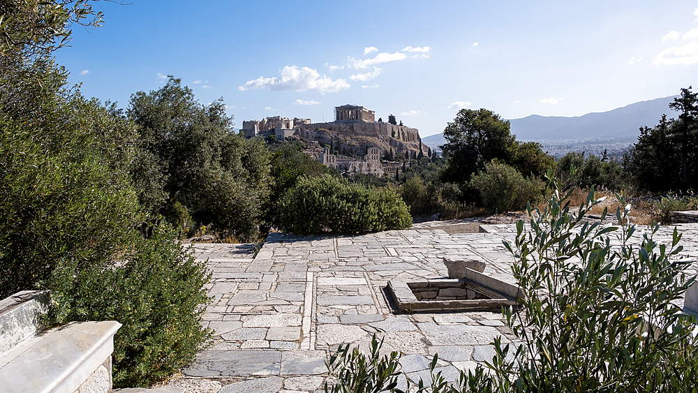 View of the Acropolis of Athens from Mouseion Hill, located to the southwest. The Acropolis, an ancient citadel perched on a rocky outcrop above the city, contains the remains of several significant ancient buildings, including the Parthenon.