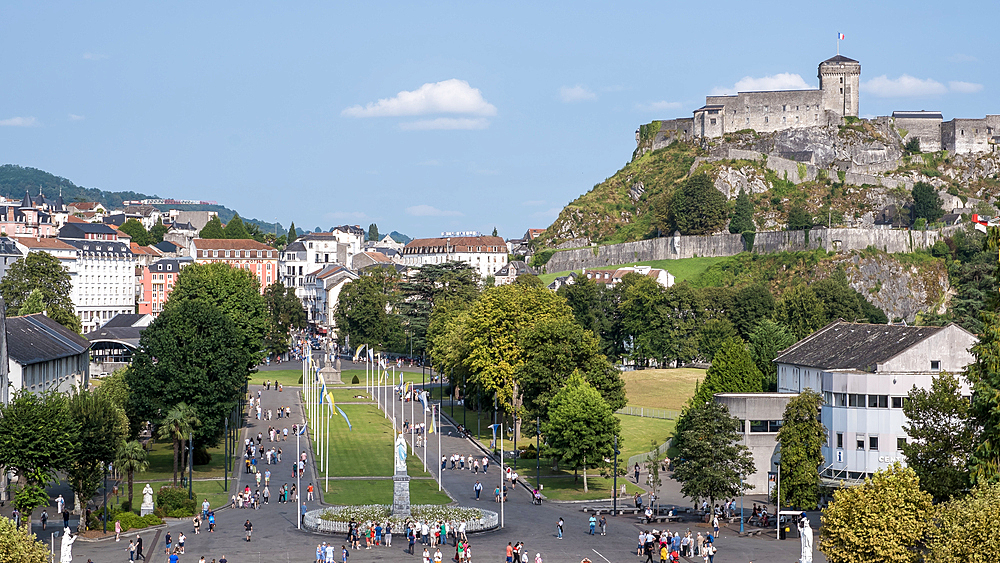 Urban landscape of Lourdes, a market town in the Pyrenees, Hautes-Pyrénées, Occitanie, southwestern France, with the Château Fort in the background.