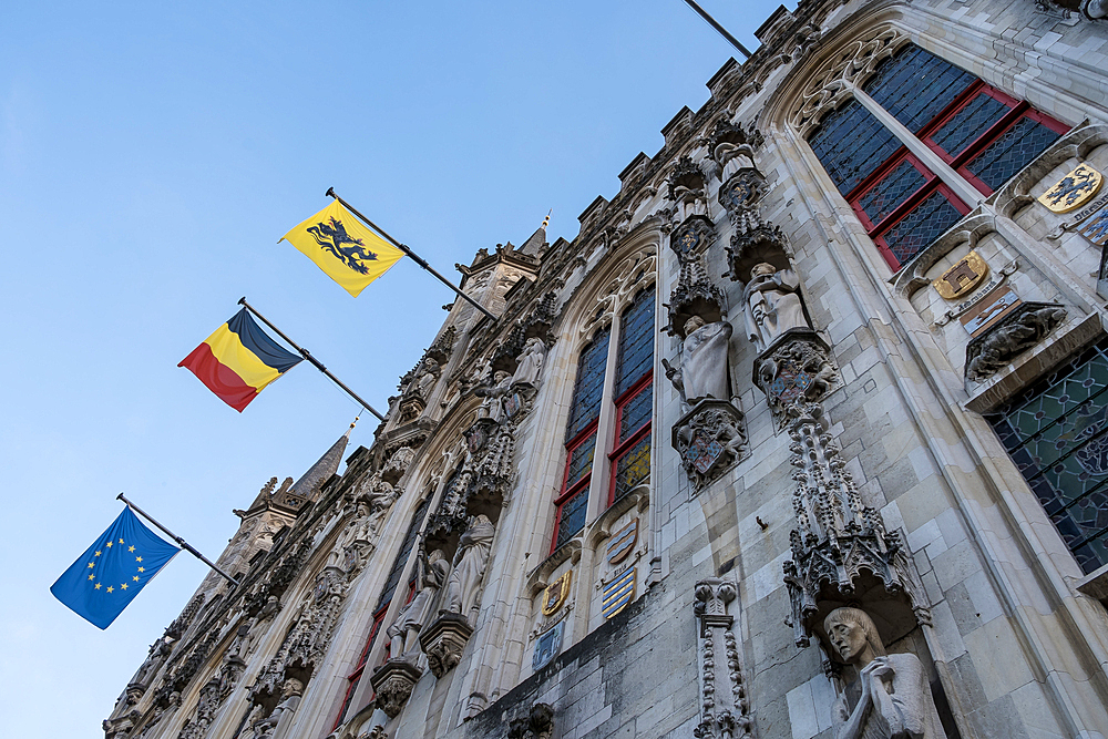 Bruges, Belgium – Architectural detail of the City Hall, a late-Gothic landmark built between 1376 and 1421. One of the oldest city halls in the Burgundian Netherlands, it stands on historic Burg Square.