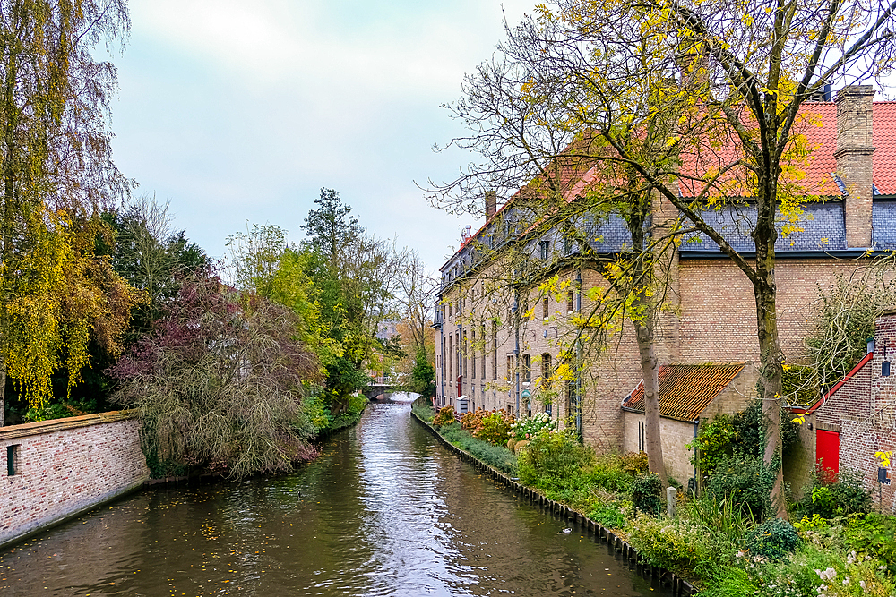 Bruges, Belgium – View of the exterior of the Princely Beguinage Ten Wijngaerde. A historic site with whitewashed façades, it reflects the city's medieval charm.