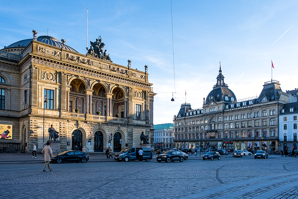 Copenhagen, Denmark – View of Kongens Nytorv (The King’s New Square) with Det Kongelige Teater (The Royal Theatre) on the left and Magasin du Nord on the right, framing this iconic civic space.