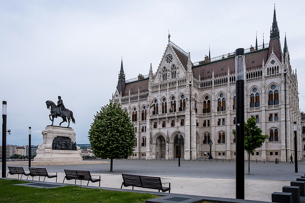 Budapest, Hungary – Architectural detail of the Hungarian Parliament Building, showcasing its Neo-Gothic façade with ornate spires, arched windows, and sculpted figures that reflect Hungary’s medieval heritage and national symbolism.