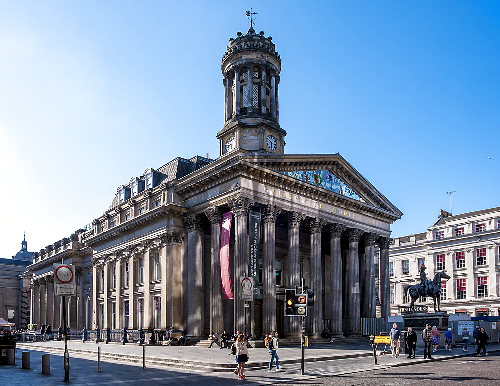 Glasgow, Scotland – Architectural detail of the Gallery of Modern Art with the iconic equestrian statue of the Duke of Wellington in the front, known for its traffic cone tradition.