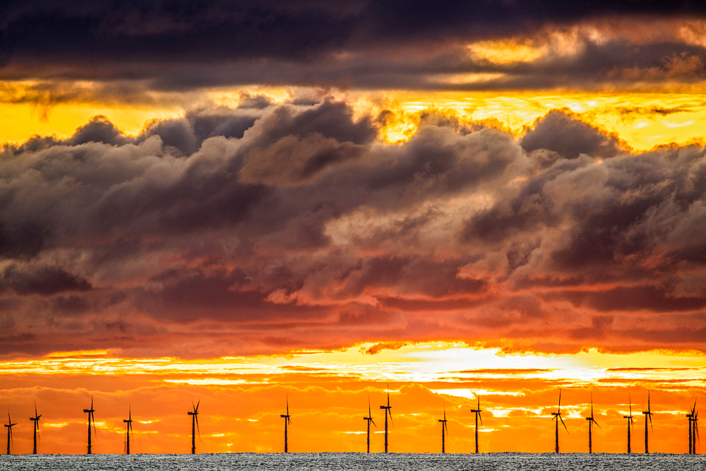 Sunset view from Walney Island across the Irish Dea towards the distant Walney Offshore Wind Farm, Cumbrian Coast, Cumbria, England, United Kingdom, Europe